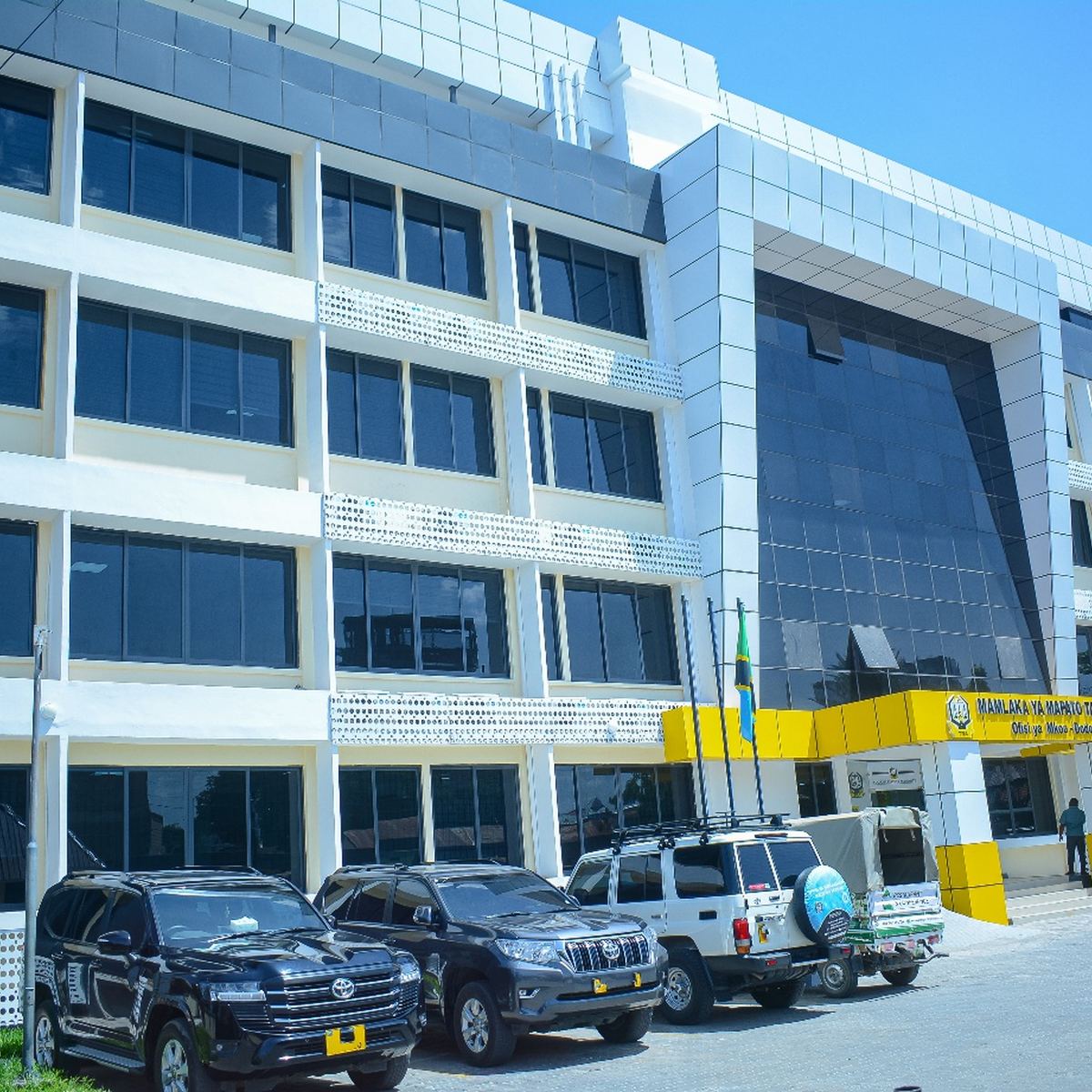Front elevation of the TRA Dodoma office building with staff car park