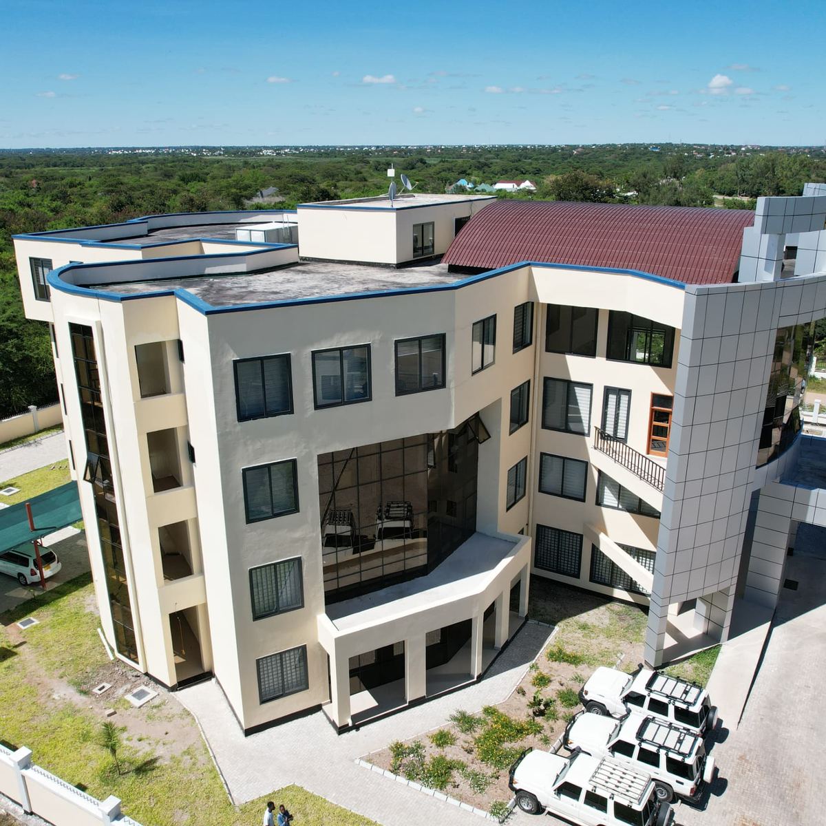 The curved façade and clad stair tower of the TRA Simiyu office